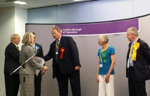 Councillor for Brentford Ward Guy Lambert being congratulated on his win by other candidates and Chief Executive of Hounslow Council